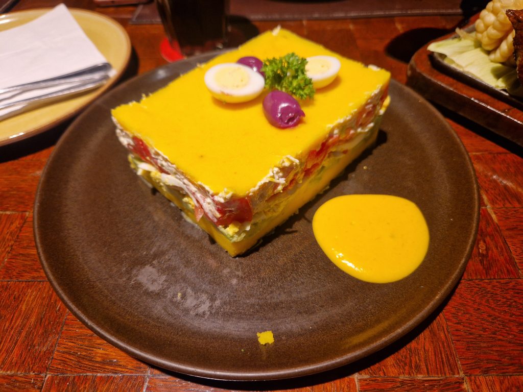 Chicken Causa Dish, Peru (© 2025 Timbuk2Stu)